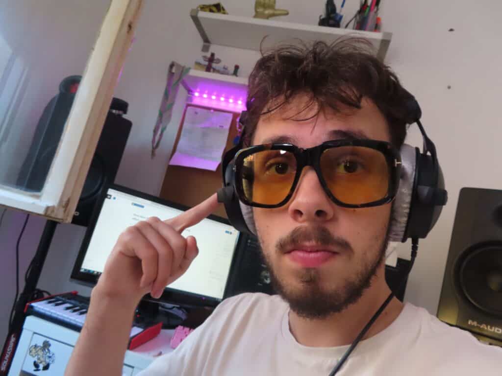 Selfie of me Den in his bedroom studio using DT700 headphones in the morning