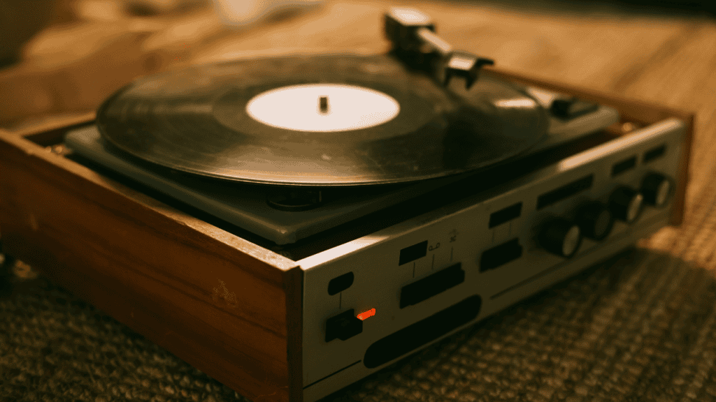 Turntable playing a vinyl record in a cozy setting