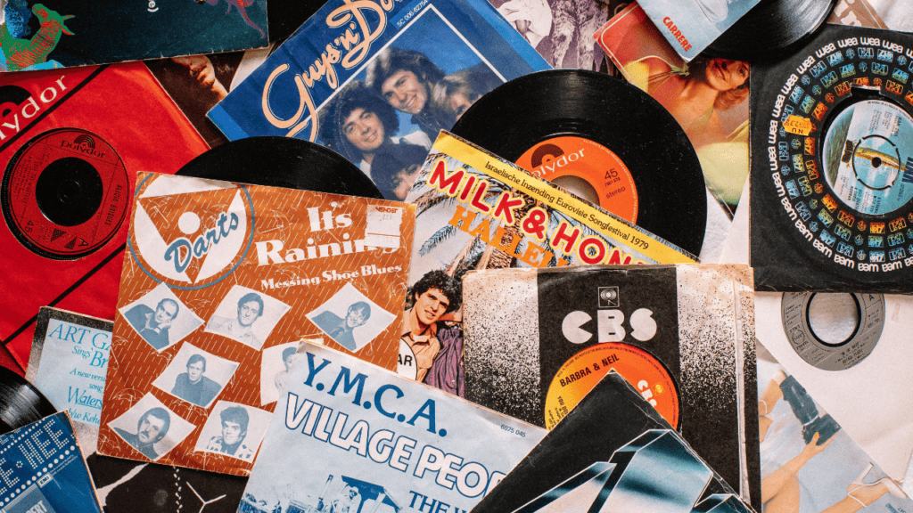 Assortment of colorful vinyl record sleeves and discs