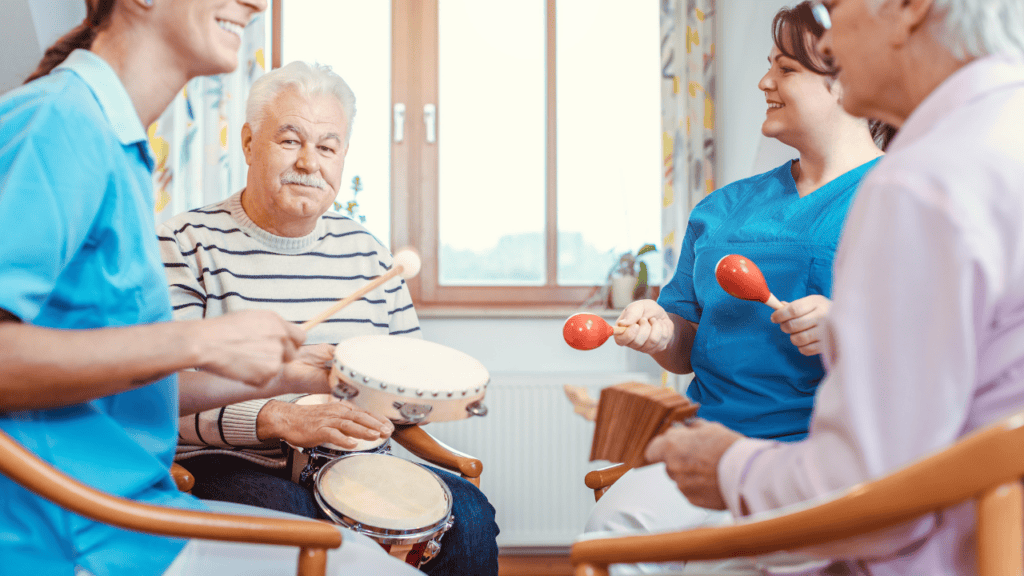 A group of individuals participating in music therapy, playing instruments in a bright, cheerful room.