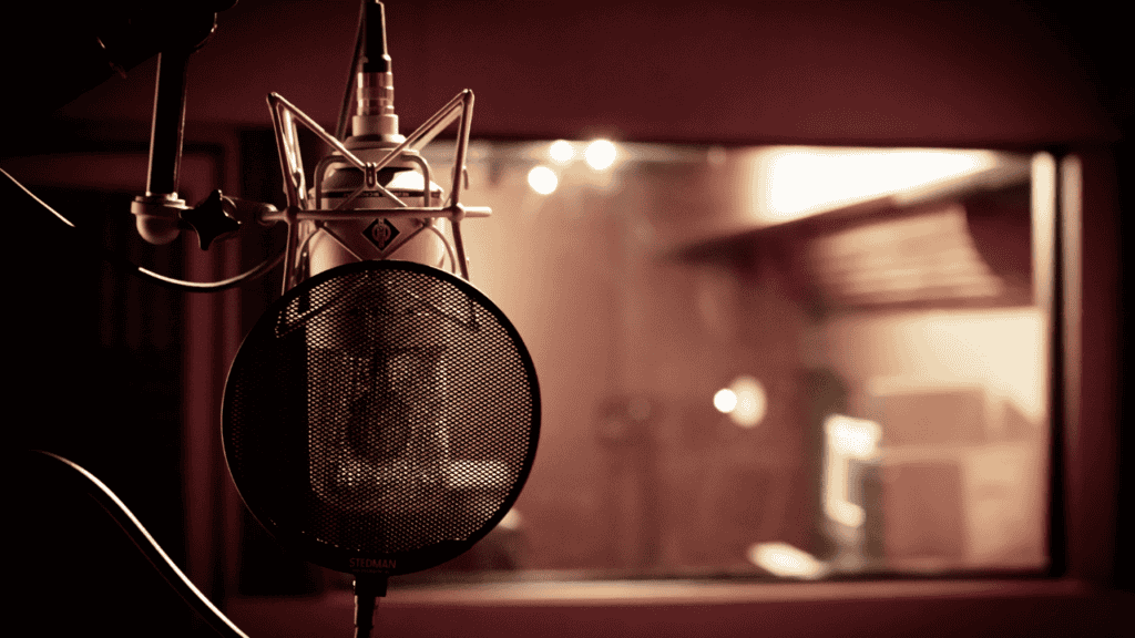 Professional microphone setup in a recording studio with ambient lighting.