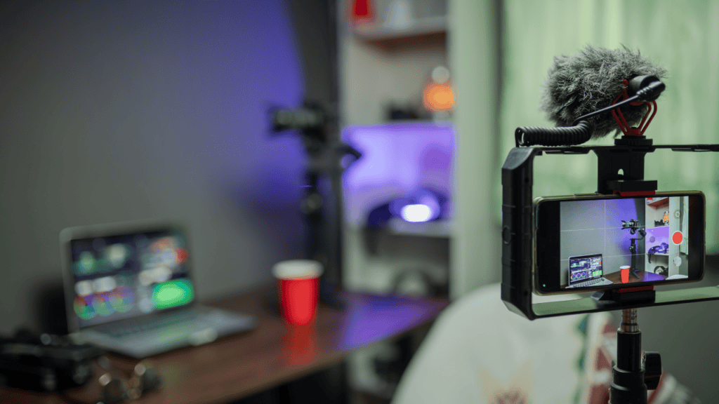 Home studio setup for live streaming with camera and laptop.