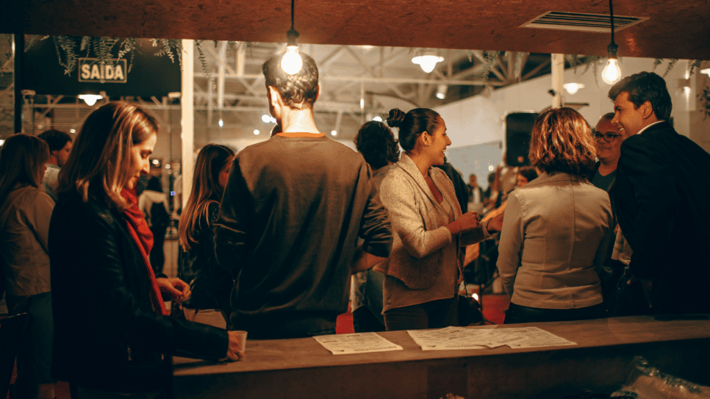 Music professionals networking at an industry event.